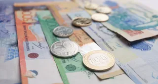 Капитал - Казахстану придется девальвировать тенге на 30%