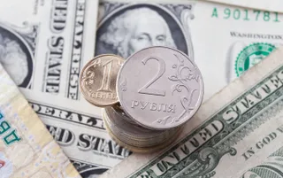 Капитал - Тенге показал уверенный рост к доллару