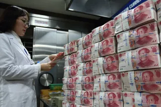 Капитал - Юань подешевел к доллару на 1%