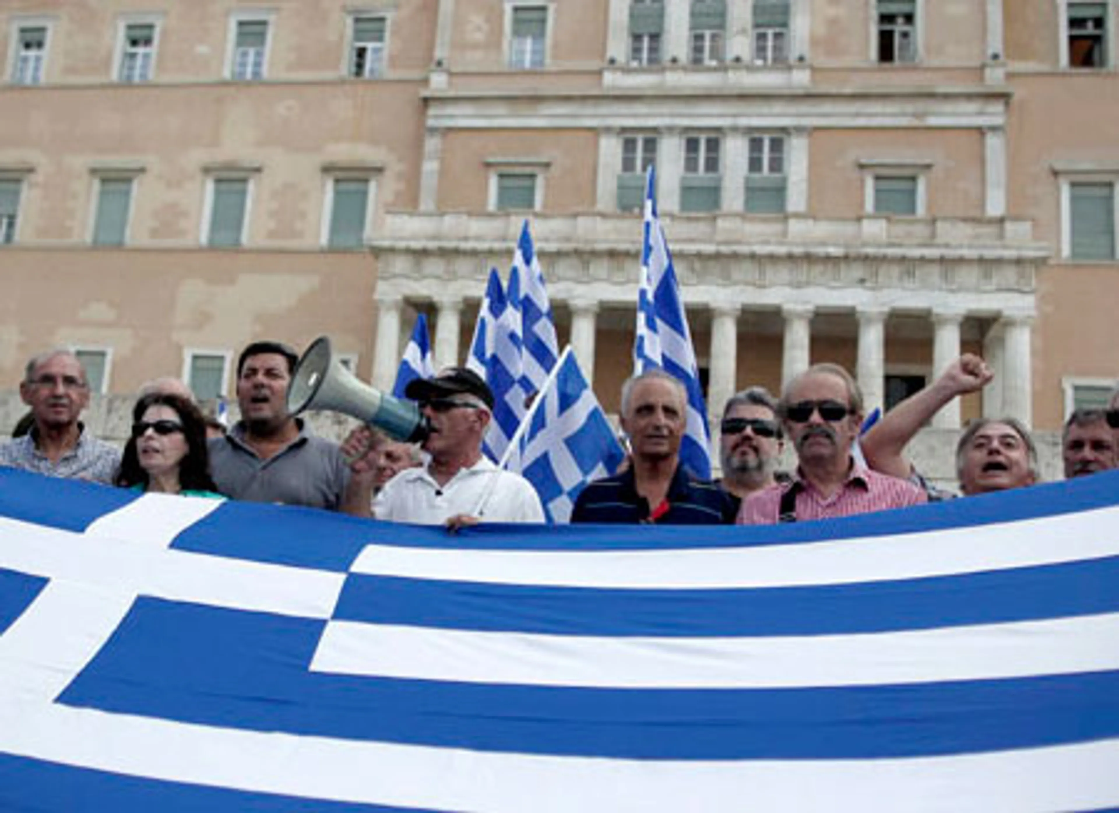 Капитал - МВФ готов остановить помощь Греции