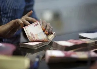 Капитал - Индонезия ввела запрет на расчеты в долларах