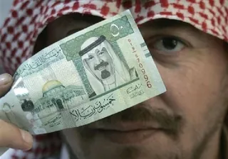 Капитал - Саудовская Аравия не исключает девальвации рияла