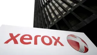 Капитал - Xerox получила чистую прибыль в III квартале